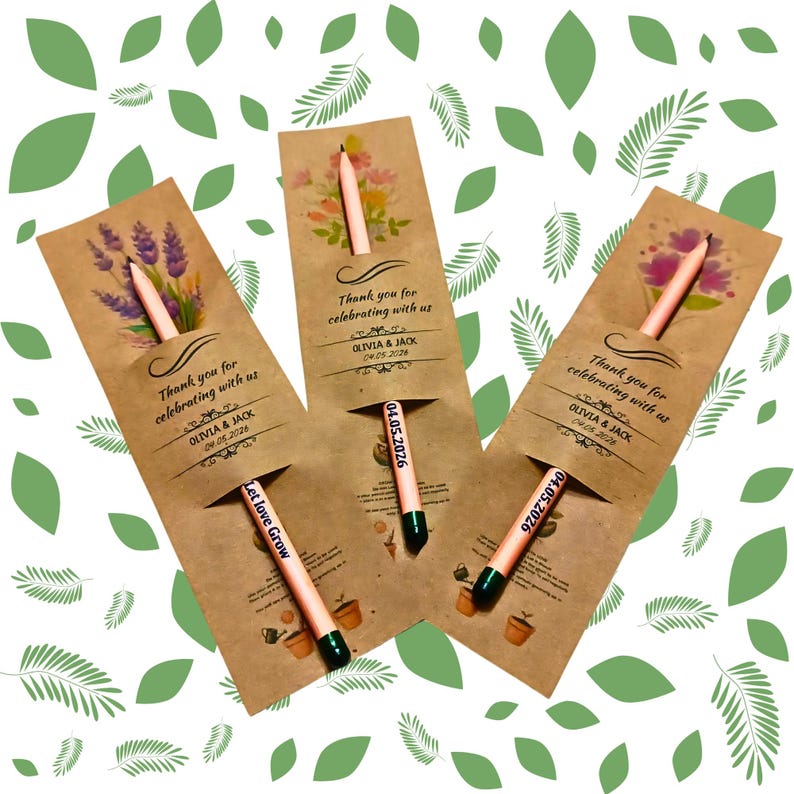 May include: Three kraft paper seed packet favors with pencils. Each packet has a floral design and the text "Thank you for celebrating with us" and the names Olivia & Jack with a date. One pencil reads "Let love Grow".