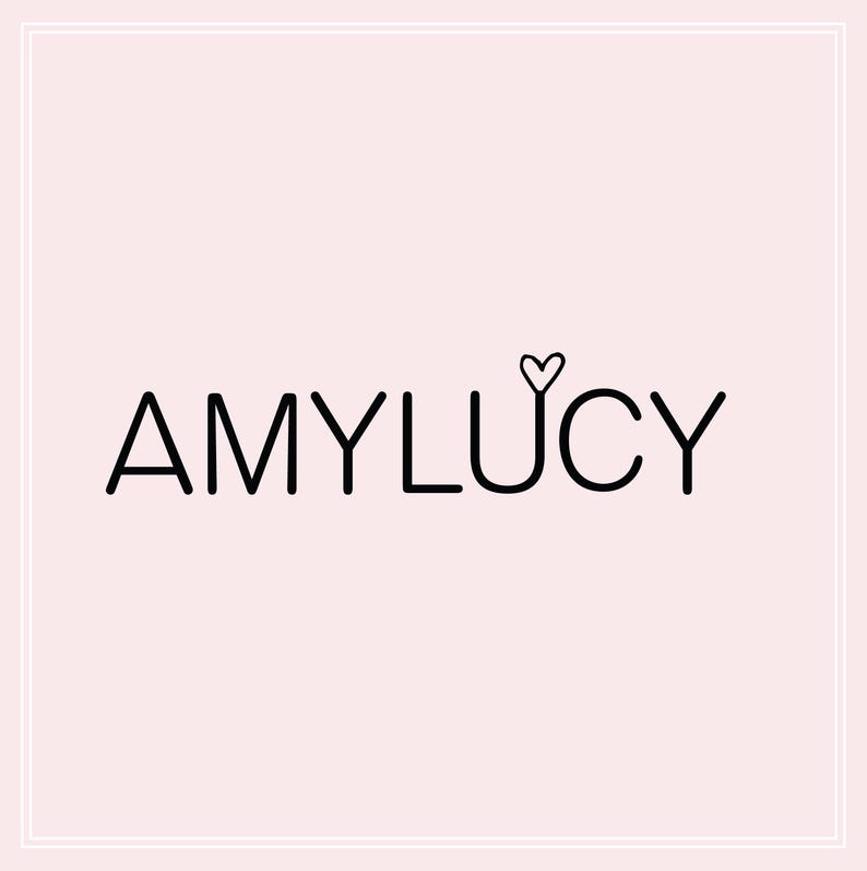 May include: Black and white logo with the text "AMYLUCY" and a small heart above the "Y".