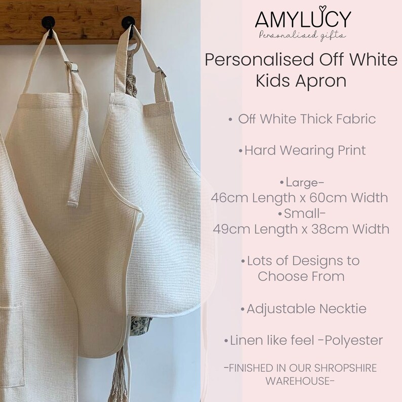 May include: Two off-white kids aprons hanging on hooks. The aprons are made of thick fabric and have an adjustable necktie. The larger apron measures 46 inches long by 60 inches wide, and the smaller apron measures 49 inches long by 38 inches wide. The aprons are personalized with a hard-wearing print. "Lots of designs to choose from." - AMYLUCY Personalised gifts. - FINISHED IN OUR SHROPSHIRE WAREHOUSE-