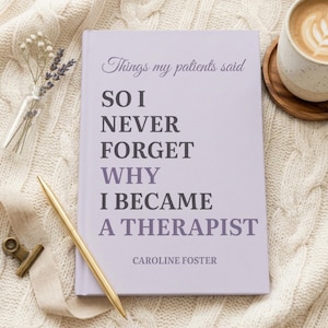 May include: A light purple hardcover book with the title Things my patients said SO I NEVER FORGET WHY I BECAME A THERAPIST and the author name Caroline Foster printed in dark purple text on the front cover, accompanied by a gold pen.