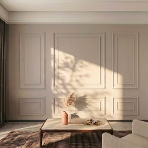 May include: A living room interior with beige walls and decorative paneling. A low, rectangular coffee table with a marble top and wooden frame sits on a patterned rug. A vase with dried flowers and a small tray are on the table.