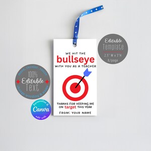 May include: A white gift tag with a blue ribbon, featuring the text "WE HIT THE bullseye WITH YOU AS A TEACHER." A red target with a blue arrow is in the center. The tag is 2.5 inches wide and 3 inches high.
