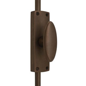 May include: A dark bronze-toned metal window sash lock featuring a rectangular base plate with four visible screw holes and a central oval-shaped knob. The hardware is mounted on a vertical rod, showcasing a smooth, matte finish throughout.