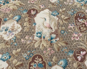 May include: A beige fabric with a repeating pattern of brown, blue, and pink flowers, birds, and vases. The background is a brown honeycomb pattern.