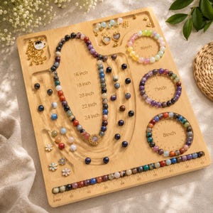 May include: A wooden jewelry design board featuring U-shaped channels with markings for 16, 18, 20, 22, and 24 inches, and circular indentations labeled 6, 7, and 8 inches. It includes multicolored beads, a necklace, bracelets, and small charms.