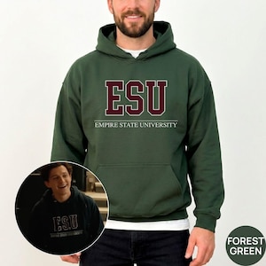 May include: A forest green hooded sweatshirt featuring the text ESU in large maroon letters with white outlines, positioned above the words EMPIRE STATE UNIVERSITY in white text. The hoodie includes a front kangaroo pocket and long sleeves.