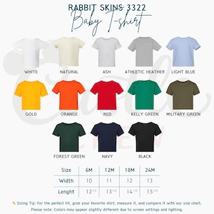 May include: A color chart for Rabbit Skins 3322 baby t-shirts featuring thirteen solid colors: white, natural, ash, athletic heather, light blue, gold, orange, red, kelly green, military green, forest green, navy, and black, with a size chart.