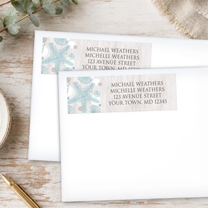 May include: Two white envelopes with address labels featuring a light blue starfish and seashell design. The labels include the names Michael and Michelle Weathers, an address, and the city, state, and zip code.