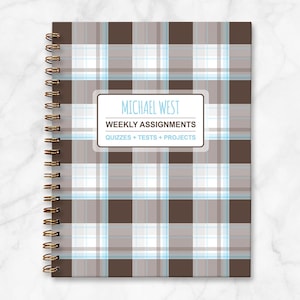 May include: A brown and white plaid notebook with a white label that says "MICHAEL WEST WEEKLY ASSIGNMENTS QUIZZES + TESTS + PROJECTS".