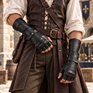 May include: A pair of black fingerless leather gauntlets featuring crisscross lacing, adjustable straps with metal buckles, and reinforced stitching. The gauntlets extend from the knuckles to the mid-forearm, providing a structured fit.
