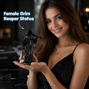 May include: A black statue of a hooded figure in a long robe, holding a long-barreled firearm in the right hand and resting another across the left shoulder. The text "Female Grim Reaper Statue" is visible above the object in the image.