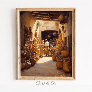 Puede incluir: Una impresión enmarcada de una escena de taller de cerámica. La obra representa a un hombre rodeado de numerosas ollas y vasijas de terracota. La escena está bañada en tonos cálidos y terrosos, con el texto "Chris & Co." en la parte inferior.