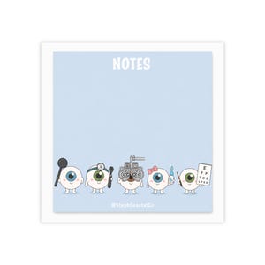 May include: Light blue notepad with the word "NOTES" at the top. The bottom of the notepad features a row of cartoon eyeballs, each with different eye care tools. The notepad has the text "@StephCoastalCo" at the bottom.
