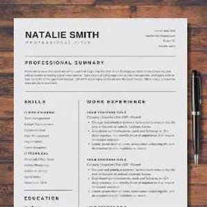 May include: A resume template with the name "Natalie Smith" at the top, along with sections for professional summary, skills, work experience, and education. A black pen rests on a wooden surface next to the resume.