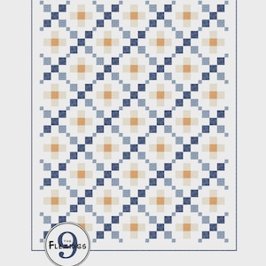 May include: A quilt with a repeating geometric pattern of squares and crosses in shades of white, navy blue, light blue, and orange. The quilt has a white border and a circular logo in the bottom left corner that reads "The Flemings 9".