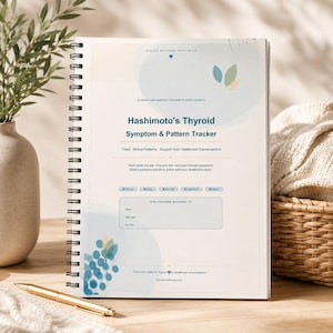 May include: A spiral-bound Hashimoto's Thyroid Symptom & Pattern Tracker notebook with a cream cover featuring blue and green leaf graphics. The text reads: Hashimoto's Thyroid Symptom & Pattern Tracker, Track-Notice Patterns-Support Your Healthcare Conversations.