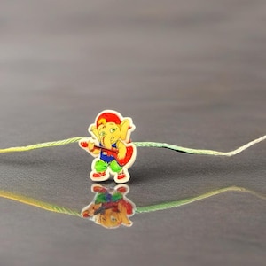 Kids Rakhi with Cartoon Ganesha Playing Guitar | Funky Rakhi for Boys | Eco-Friendly Rakhi Bracelet | Raksha Bandhan 2025 Special