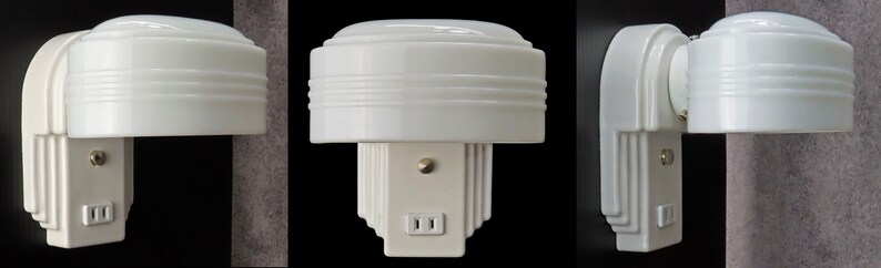 Puede incluir: Luz de noche blanca de estilo Art D&eacute;co, con una parte superior redondeada y una base rectangular. Incorpora una toma de corriente integrada y un peque&ntilde;o interruptor. El dise&ntilde;o presenta l&iacute;neas horizontales y detalles escalonados, creando una apariencia cl&aacute;sica y estilizada.