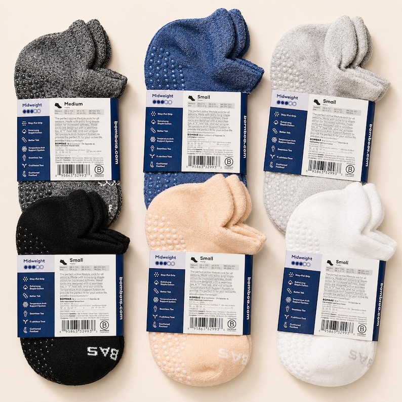May include: An assortment of six pairs of Midweight socks in various colors, including gray, navy blue, light gray, black, beige, and white. Each pair has a non-slip grip and is labeled with the brand name and size.