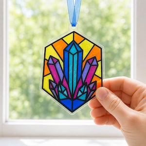 Suncatcher kit in a hand for scale