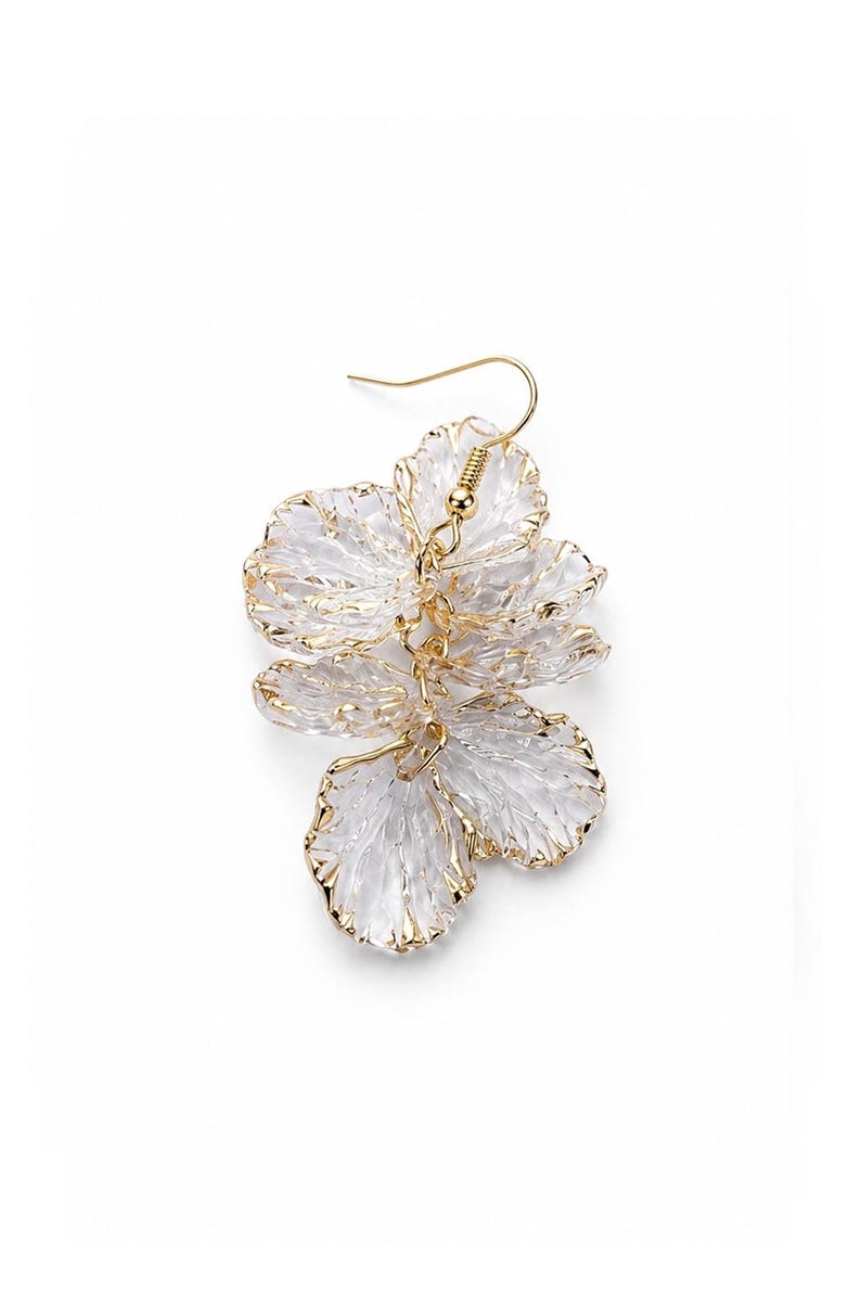 May include: A single gold-tone earring featuring a floral design. The earring has three layered, translucent, petal-shaped elements with gold trim. The earring hook is gold-colored.