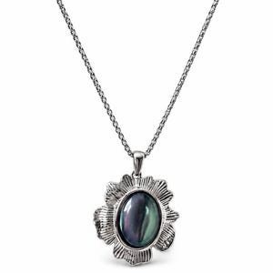 May include: A silver-toned necklace featuring a pendant with a central oval-shaped iridescent dark stone. The stone is surrounded by a textured, scalloped metal frame resembling a flower, suspended from a delicate silver-toned box chain.