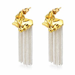 May include: A pair of gold-tone earrings with a textured, organic shape at the top and cascading silver-tone chain fringe. The earrings have a post-back closure and are displayed against a white background.