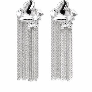 May include: A pair of silver earrings. Each earring has an abstract, textured top with multiple strands of delicate chain hanging down. The earrings are set against a white background, highlighting their reflective surface.