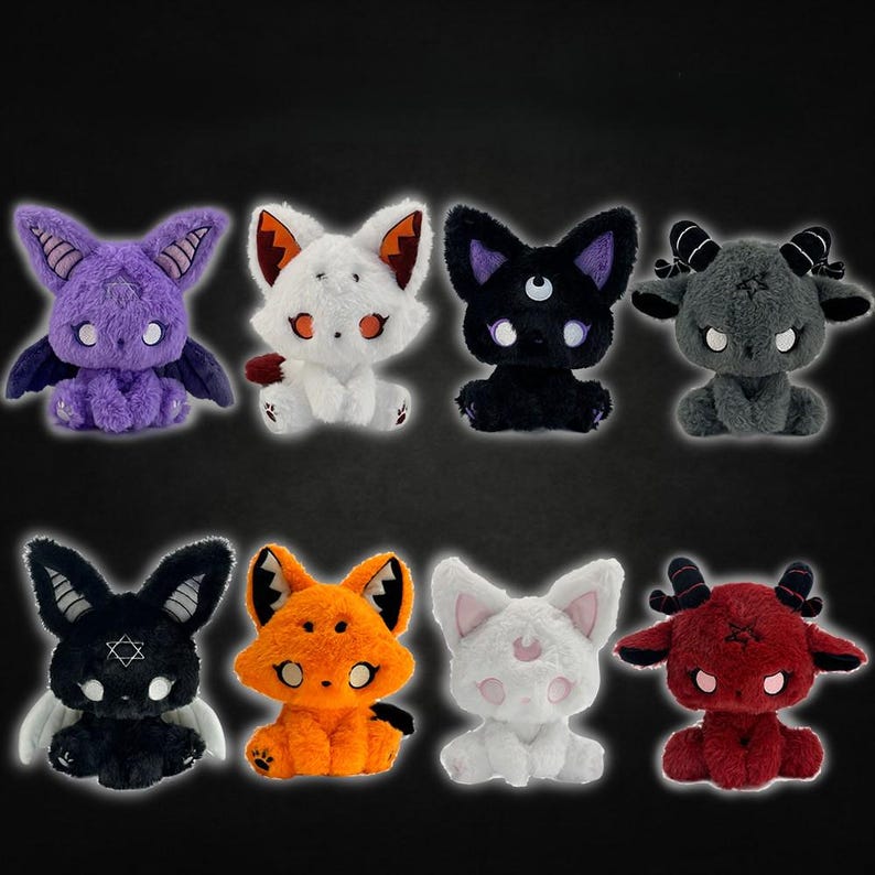 May include: Eight plush toys in various colors and designs, including a purple bat, white fox, black cat, and gray goat. Each plush has unique features like horns, wings, and symbols, with a dark aesthetic.