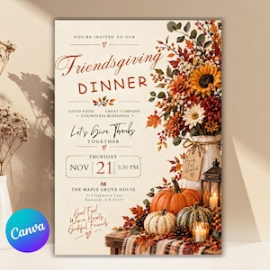 May include: A Friendsgiving dinner invitation card featuring text on a cream background, a floral arrangement with sunflowers and autumn leaves in a vase, two pumpkins, a lantern with a lit candle, and a plaid cloth on a wooden surface.