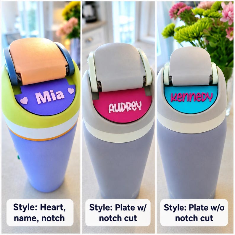 May include: Three insulated tumblers with flip-top lids. The first is lime green and purple with a peach lid and a purple nameplate reading Mia with two hearts. The second is gray with a pink nameplate reading Audrey. The third is gray with a blue nameplate reading Kennedy.