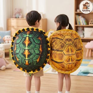 May include: Two plush turtle shells worn on the back, one featuring a dark green and black patterned design and the other a golden brown and black patterned design. Both shells have a yellow border and are shaped like realistic turtle carapaces.