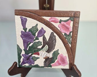 This item is a decorative art tile, often produced in collectible series or...