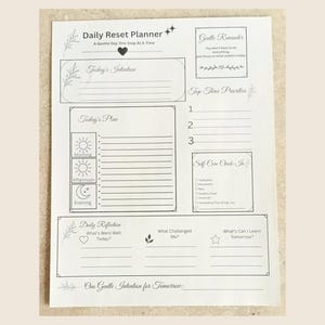 May include: A white Daily Reset Planner sheet with black text and line art. Sections include Today's Intention, Top Three Priorities, Today's Plan with morning, afternoon, and evening icons, a Self-Care Check-In, Daily Reflection, and One Gentle Intention for Tomorrow.