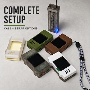 May include: A collection of rectangular electronic device cases in various colours including olive green, brown, white, and textured grey, alongside a translucent case. A vertical grey device with a blue light is connected to a cable. Text reads COMPLETE SETUP CASE + STRAP OPTIONS.