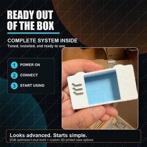 May include: A white 3D printed rectangular case with a light blue interior and three grey chevron-like vents on the front. The image includes text: READY OUT OF THE BOX, COMPLETE SYSTEM INSIDE, 1 POWER ON, 2 CONNECT, 3 START USING, Looks advanced. Starts simple.
