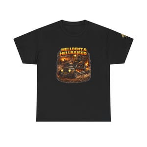 May include: Black t-shirt featuring a graphic of a hot rod with flames and the text "HELLBENT & HELLRAISED" in orange and yellow. The design has a vintage, cartoonish style, with a bear driving the car.
