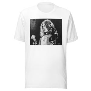 May include: White t-shirt with a black and white portrait of a musician with long, wavy hair. The portrait is centered on the shirt and is in a vintage style.