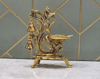 two beautifully crafted decorative oil lamps placed side by side.