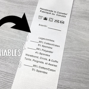 May include: A white fabric label with black text detailing the materials used in the garment. The label states "Handmade in Canada/Fabriqu&eacute; au Canada" and lists the fabric content as 95% cotton and 5% spandex for the legs and 96% polyester and 4% spandex for the waistband, circle, and cuffs.