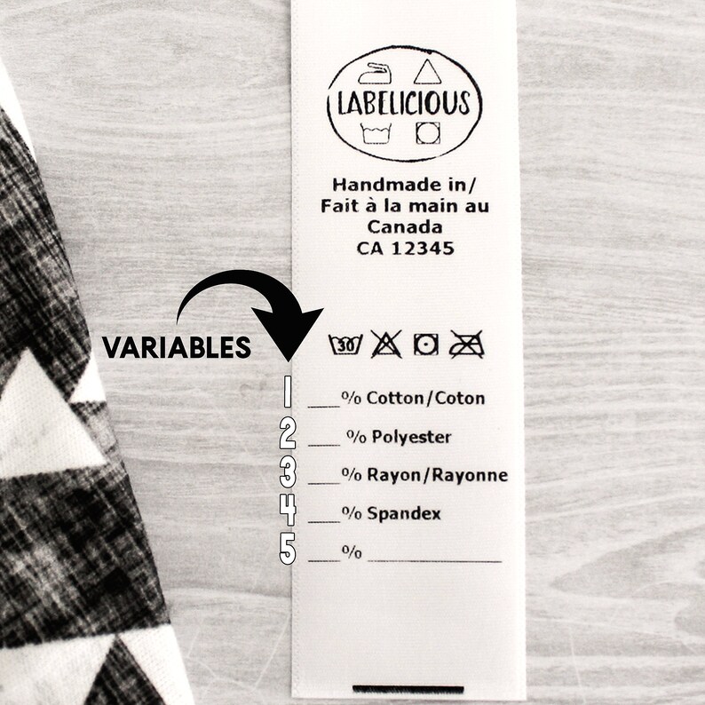 May include: A white fabric label with black text and symbols. The label reads "LABELICIOUS" and "Handmade in/ Fait &agrave; la main au Canada CA 12345". Below the text are symbols for washing instructions. The label also includes a list of fabric percentages: Cotton/Coton, Polyester, Rayon/Rayonne, Spandex.