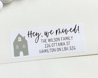 May include: A white sticker with a house illustration and the text "Hey, we moved!"  The Wilson Family, 226 Ottawa St, Hamilton ON L8H 326.