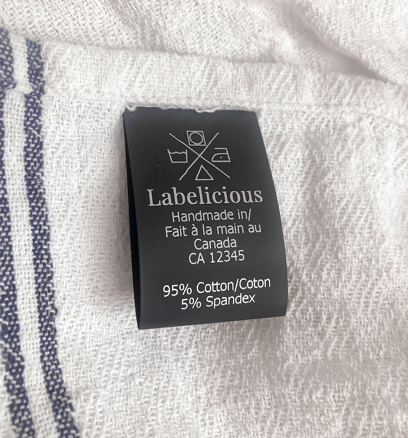 May include: Black and white care label with the text "Labelicious Handmade in/ Fait &agrave; la main au Canada CA 12345 95% Cotton/Coton 5% Spandex".
