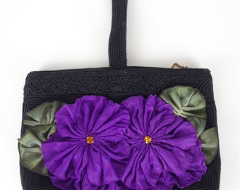 Linnaea, 1940s, WWII black corde wristlet swing purse, zipper closure, handmade twin purple flower brooch