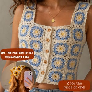 May include: A sleeveless crochet top constructed from square motifs featuring a white, light blue, and yellow floral pattern. The garment has a square neckline and a front button placket with five light brown wooden buttons. A small inset shows a yellow, white, and brown sunflower-patterned crochet bandana.