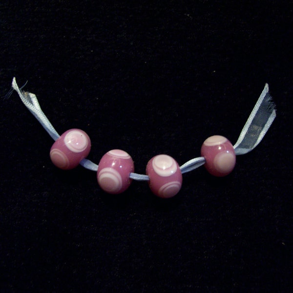 Set of 4 Lampwork Beads in Pinks on a ribbon