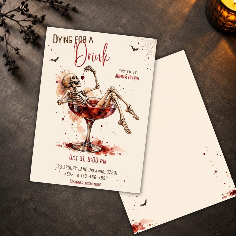 May include: A rectangular Halloween party invitation card featuring a skeleton lounging in a large cocktail glass filled with red liquid. The text reads Dying for a Drink, Hosted by John & Olivia, Oct 31, 8:00 PM, 123 Spooky Lane Orlando, 32801, RSVP to 123-456-7890, Costumes Encouraged.