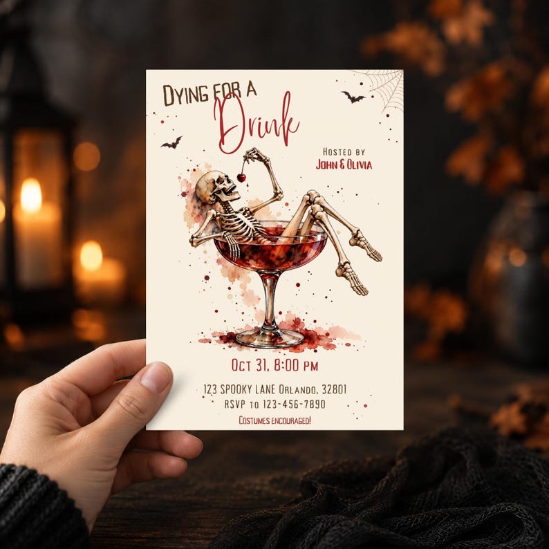 May include: A rectangular invitation card with a cream background featuring a watercolor illustration of a skeleton relaxing in a large cocktail glass. The text reads Dying for a Drink, Hosted by John & Olivia, Oct 31, 8:00 PM, 123 Spooky Lane Orlando, 32801, RSVP to 123-456-7890, Costumes Encouraged.
