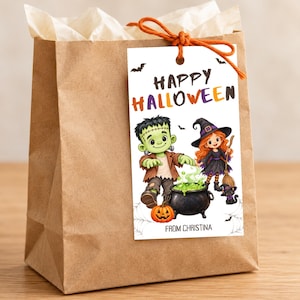 May include: A brown paper gift bag with a white rectangular tag attached by an orange string. The tag features the text "HAPPY HALLOWEEN" and "FROM CHRISTINA" with illustrations of a green monster, a witch, a black cat, and a bubbling cauldron.