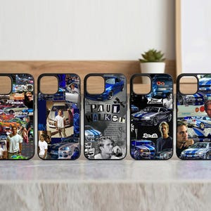 May include: Five black phone cases with images of cars and people. The cases feature collages of images, including cars, portraits, and text. One case has the text "PAUL WALKER" in large letters. The cases are arranged in a row.